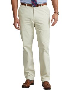 Ultra-soft stretch cotton and a relaxed fit make these chinos from Polo Ralph Lauren a comfortable classic you’ll wear again and again.97% cotton/3% elastaneFlat-front style Zip fly with a buttoned closureBelt loopsSide pockets, right hip coin pocket, back left buttoned pocket, back right button-and-loop pocket  Signature embroidered Pony above the back right pocketSize 46W has a 12½" rise and a 19½" leg openingDue to the natural characteristics of this material, the coloring may rub off onto fa Solid Color Straight Fit Cotton Bottoms, Solid Color Relaxed Fit Straight Leg Chinos, Casual Dress Pants With Relaxed Fit, Solid Straight Cotton Bottoms, Solid Cotton Straight Bottoms, Straight Cotton Dress Pants With Welt Pockets, Solid Cotton Dress Pants With Straight Hem, Straight Fit Cotton Bottoms, Relaxed Fit Straight Leg Chino Dress Pants