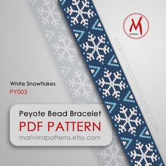 a blue and white bead bracelet with snowflakes in the middle on a gray background