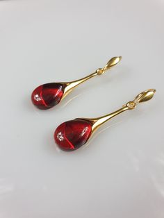 Ruby red Ambrer. Gold plated sterling silver. With hallmarks. Ear wire. Earrings length 4,5 × 1 cm Weight 4,1 gr. Matching ruby red pendant: https://www.etsy.com/uk/listing/898886026/ruby-red-amber-pendant-gold-plated?ref=listings_manager_grid Black friday sell. Small Christmas gift idea. This item was made of natural Baltic Amber. All the amber used in my jewelry is collected in my home country Lithuania. I sell only genuine, real, not pressed, authentic, natural Baltic Amber. Item may have nat Polished Drop Earrings For Gift, Polished Finish Drop Earrings For Gift, Elegant Red Earrings With Polished Finish, Gift Long Drop Earrings With Polished Finish, Red Polished Earrings For Gift, Red Drop Earrings For Gift, Red Drop Earrings For Formal Occasions, Elegant Wire Wrapped Amber Earrings, Elegant Amber Wire Wrapped Earrings