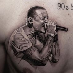 a drawing of a man singing into a microphone with the words 90's rock written on his chest