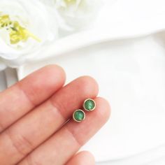 💚 Genuine Green Jade Stud Earrings with choices of 14K Gold filled, Rose Gold Filled and Sterling Silver•Jade Size: 4mm✨ Jade is believed to bring good luck. This bright green gemstone is thought to bring protective, lucky-charm energy to the wearer ✨• 14K gold-filled and Sterling Silver is known for its lasting quality. These earrings will last for decades and are considered lifetime pieces of jewelry.• These earrings won’t tarnish. You can wear them every day or even in a shower. You never ha Green Birthstone Earrings For Everyday, Yellow Gold Earrings For May Birthstone, Dainty May Birthstone Earrings, Dainty Earrings For Jewelry Making With May Birthstone, Dainty Round Earrings For May Birthstone, Dainty Emerald Earrings As A Gift, Dainty Emerald Earrings Gift, Minimalist Green Earrings For Anniversary, Green Minimalist Earrings For Anniversary