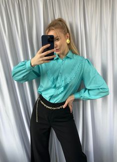 The turquoise color is a beautiful and vibrant shade that is perfect for adding a pop of color to any outfit.  When styling this blouse, you can pair it with a variety of different items to create a chic and sophisticated look. For example, you could wear it with a pair of high-waisted trousers or a pencil skirt for a more formal occasion. Alternatively, you could pair it with a pair of jeans and some cute flats for a more casual look. - Good vintage condition (no visible sings of wear) - TAG SI Elegant Green Spring Shirt, Elegant Green Shirt For Spring, Elegant Solid Color Shirt For Spring, Elegant Green Summer Shirt, Trendy Spring Blouse With Ruffled Collar, Elegant Solid Color Summer Shirt, Trendy Summer Blouse With Ruffled Collar, Trendy Solid Color Spring Blouse, Trendy Solid Color Blouse For Spring