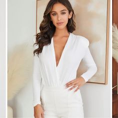 New With Tags! Deep V-Neck Nice Blouse That’s A Bodysuit. Soft And Stretchy Material. Has Small Shoulder Pads! Feminine V-neck Jumpsuits And Rompers For Night Out, Fitted V-neck Bodysuit For Date Night, Chic V-neck Bodysuit For Date Night, Feminine V-neck Jumpsuits And Rompers, Elegant V-neck Bodysuit For Party, Elegant V-neck Bodysuit For Date Night, Feminine Stretch Bodysuit For Night Out, White Stretch Bodysuit For Work, Chic White V-neck Bodysuit