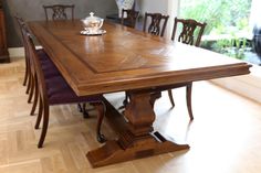 a large wooden table with chairs around it