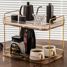 a tray with coffee cups and two mugs on it, sitting on a table