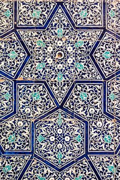 an intricate blue and white tile pattern on the side of a building in morocco, africa