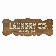 a wooden sign that says laundry co