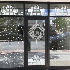 an open window with the words joy written on it in front of a city street