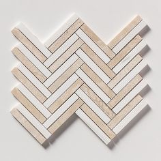 white marble herringbones arranged in a diagonal pattern