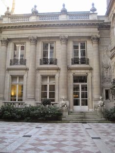 an old building with many windows and steps