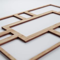 an image of some wooden squares on a white surface