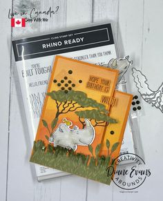 a card with an elephant on it next to a stamp and some other paper items