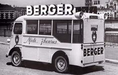 an old black and white photo of a food truck