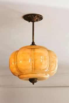 a light fixture hanging from the ceiling in a room