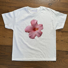 Hibiscus Baby Tee & T-shirt

Our tees are mid-weight 100% cotton with a classic 90's baby tee fit.
Shipping: Currently we ship worldwide from the following distribution hubs: UK, USA, Germany, Canada, Poland and Australia.