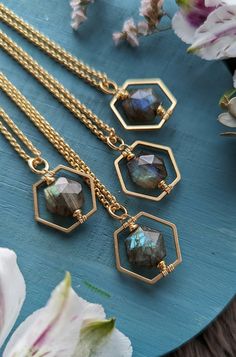 "This simple, layering necklace features a faceted, hexagon-shaped Labradorite gem within a satin gold Hexagon frame.  The stones are dark with flashy green, teal, and/or blue when the light hits them.  (If you have a preference on the color of flash, please either message me or leave a note in the Note to Seller section at checkout.) The pendant measures just shy of 1\" long x .75\" wide on a satin gold-plated rolo chain with a satin gold lobster claw clasp.  You may choose your preferred length of chain: 16\", 18\", 20, or 22\".  (If you would prefer a different length, just message me!  I'd be happy to accommodate!) The chain is electro-plated, solid brass, and nickel-free. Thanks for checking out the shop and feel free to drop me a line if you have any questions!" Silver Hexagon Necklace For Jewelry Making, Minimalist Faceted Octagon Jewelry, Elegant Faceted Hexagon Necklace, Minimalist Octagon Faceted Jewelry, Minimalist Hexagon Faceted Jewelry, Elegant Hexagon Faceted Necklace, Handmade Hexagon Necklace For Gift, Hexagon Gemstone Necklace As A Gift, Hexagon Gemstone Necklace For Gift