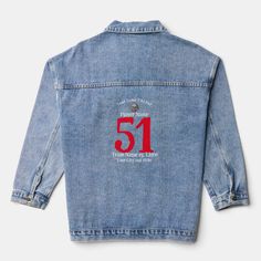 a jean jacket with the number 51 printed on it's back and red lettering