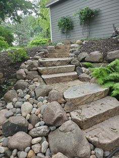 stone steps lead up to the side of a house