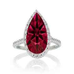 Pear Cut Ruby Halo Desiger Engagement for Woman. If you are looking for a Ruby gemstone engagement ring set at affordable prices then look no further than this beautiful Ruby and diamond wedding engagement ring. This ring can be customized to 10k 14k or 18k gold.. The diamonds are "I" Clarity and "I-J" color. Our gemstones are AA grade. The Diamond and Gemstone cut ranges from Round, Princess, Pear, Oval, Cushion.Most of our rings can be customized to your choice of metal like 10k Gold, 14k Gold Ruby Wedding Rings, Ruby Jewellery, Pink Morganite Engagement Ring, Gemstone Engagement Ring, Drop Ring, Ruby Rings, Black Gold Jewelry, Purple Amethyst Ring, Engagement Rings Affordable