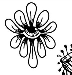 an eye is shown in the center of a flower with black and white lines on it