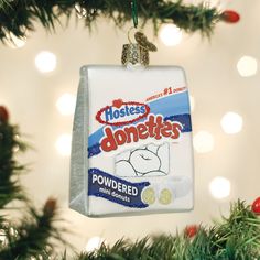 an ornament hanging from a christmas tree that says hostess donuts powdered