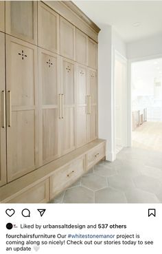 a large wooden cabinet sitting in the middle of a room