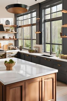 a kitchen with lots of counter space and open shelves on the wall, along with a bowl of fruit