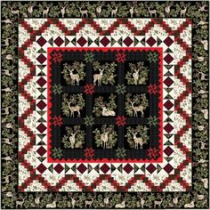 a christmas quilt with deers and holly wreaths on the center, surrounded by evergreen leaves