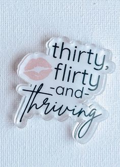 there is a sticker with the words thirty flirty and thriving on it