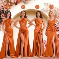 four women in orange dresses standing next to each other and posing for the camera with their hands on their hips