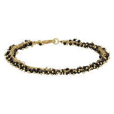 This super lightweight bracelet is packed with tiny black onyx drops on decorative gold finish ball-tip headpins. With a slinky texture, this barely-there bracelet is comfortable and easy to wear all day long. Black Metal Bracelets With Lobster Clasp, Black Metal Bracelet With Lobster Clasp, Brass Bracelets With Round Gold Beads, Black Bracelet With Gold Beads, Adjustable Black Chain Bracelet With Lobster Clasp, Adjustable Gold Onyx Bracelets, Adjustable Gold Onyx Bracelet, Hand-strung Onyx Jewelry In Gold, Elegant Gold Bracelets With Black Beads