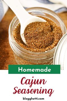 homemade cajun seasoning in a jar with a spoon