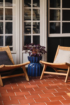 Create an inviting front porch with cozy fall decor. Style woven wood accent chairs with neutral-hued pillows for a relaxed vibe. Add a glossy blue accent table for a pop of color and a terracotta planter filled with autumn plants boasting deep purple leaves for a seasonal touch.

Shop for your home at Birch Lane. Blue Accent Table, Autumn Plants, Purple Leaves, Cozy Fall Decor, Woven Wood, Blue Accent, Terracotta Planter, Wood Accent