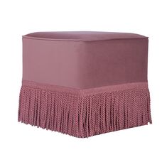 a pink ottoman with fringe trim on it