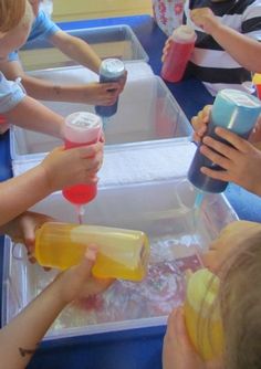 several children are playing with water play toys