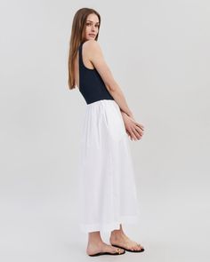 The Samantha Dress combines a jersey scoop neck tank with a cotton poplin gathered skirt. This style comes in a midi length and includes pockets. Cotton Midi Dress With Gathered Skirt For Daywear, White Cotton Dress With Voluminous Skirt, White Cotton Midi Dress With Pleated Waist, Casual Midi Dress With Gathered Skirt For Daywear, Summer Midi Dress With Pleated Waist And Voluminous Skirt, Summer Dresses With Pleated Waist And Relaxed Skirt, Sleeveless Midi Dress With Gathered Skirt For Daywear, Summer Dresses With Gathered Waist And Relaxed Skirt, Summer Dresses With Gathered Waist And Relaxed Fit