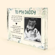 a card with an image of a baby in a glass bowl and the words to my daddy on it