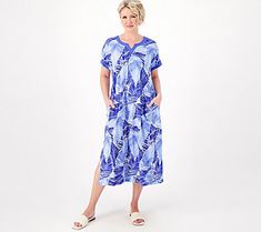 The caftan: summer's favorite silhouette. Fluid and feminine, this warm-weather staple flatters every figure with its easy, breezy nature. Throw it on over your swimsuit as an upscale cover-up, pair it with bold bangles and statement earrings when you take it out for brunch, or wear it around the house on those relaxed weekends. This caftan isn't just a style -- it's a lifestyle. From Stan Herman. Spring V-neck Beach Dress, Flowy Sleepwear For Spring Vacation, Flowy Spring Sleepwear For Vacation, V-neck Beach Sleepwear For Summer, V-neck Sleepwear For Beach In Spring, Short Sleeve Beachwear Cover-up For Daywear, Spring V-neck Beach Dress For Warm Weather, Relaxed Fit Sleepwear For Summer Vacation, Relaxed Fit Summer Sleepwear For Vacation