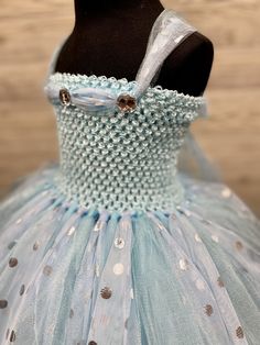 Fuzzy Duckling Design dresses ~ handcrafted for the little princess in your life. Our beautiful dresses feature a stretchy, crocheted bodice that is fully lined for both comfort and modesty. The full skirts sparkle and shine with three layers of high quality tulle in matte, shimmer, and an extra-special silver foil polka dot finish. So beautiful! Our standard dresses are designed to be tea-length and should reach to approximately mid-calf on your little princess. If your little one is slightly s Blue Ruffled Princess Dress For First Birthday, Blue Princess Tutu Dress For First Birthday, Princess Style Blue Tutu Dress For First Birthday, Blue Tulle Dress For First Birthday, Cute Blue Fairy Dress For Party, Light Blue Princess Tutu Dress For Birthday, Polka Dot Princess Dress For Party, Whimsical Blue Fitted Tutu Dress, Blue Princess Dress For First Birthday