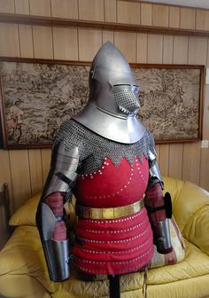 a knight costume on display in a room