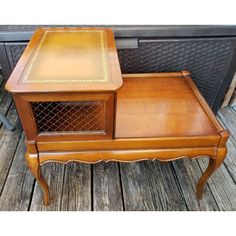 a wooden table with a drawer on top