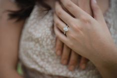 a close up of a person wearing a ring