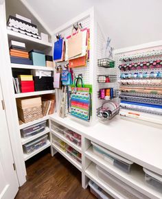 an organized craft closet with lots of supplies