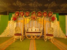 a decorated stage set up for a wedding ceremony