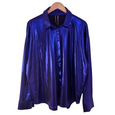 By Anthropologie The Gillian Liquid Shine Buttondown Shirt. Cobalt Blue With A Purple Undertone. Long Sleeve. Point Collar. Button Front Closure. Slightly Dropped Shoulder. Curved Hem. Pleated Yoke In Rear. 96% Polyester, 4% Elastane. Hand Wash Inside Out. Line Dry. New With Tag. Never Worn. Size: X-Large Measurements (Flat Across): Shoulders 23” Underarm To Underarm 26” Hem Sweep 26” Sleeve (Shoulder Seam To Cuff) 22.5” Length (Front, Top Of Shoulder To Hem) 27” Thanks For Shopping My Closet. B Purple Button-up Blouse For Fall, Chic Purple Collared Shirt, Purple Oversized Button-up Top, Oversized Purple Button-up Top, Trendy Purple Blouse With Buttons, Purple Button-up Blouse For Party, Blue Party Shirt For Fall, Blue Fall Party Shirt, Oversized Purple Collared Top