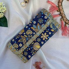 This Boho wallet is meticulously handcrafted using brocade fabric adorned with patterns reminiscent of traditional Turkish motifs, complemented by accents of vegan leather. Its allure and elegance are a testament to the classic Turkish design inspirations that grace both its front and back panels. Designed and meticulously crafted in Turkey, these wallets pay homage to the country's rich cultural heritage. Turkey is globally acclaimed for its vibrant history, stunning landscapes, and cultural di Cheap Bohemian Multicolor Wallets, Bohemian Blue Clutch For Daily Use, Blue Bohemian Clutch For Daily Use, Bohemian Blue Clutch As Gift, Traditional Multicolor Wallet For Everyday Use, Blue Bohemian Clutch Gift, Blue Bohemian Clutch As A Gift, Bohemian Blue Clutch For Gifts, Bohemian Handmade Gold Clutch