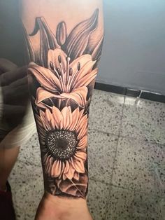 a person with a flower tattoo on their arm