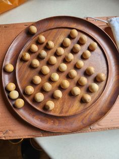 a wooden board with small round objects on it