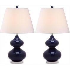 two blue lamps sitting next to each other