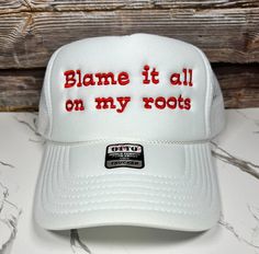 Trucker Hat Stay cool and show off unique style with this Blame it all on my roots  Embroidered Trucker Hat. This made-in-house hat is perfect for spring and summer days, especially for girls' nights out. The statement on the cap will surely turn heads and get conversations going. Be prepared to stand out. BULK ORDERS 6 PCS OR MORE! - PLEASE CONTACT US FOR A DISCOUNT CODE BEFORE ORDERING 6 PIECES= 30% OFF 12 PIECES = 40% OFF 24 PIECES = 50% OFF 48 PIECES = 55% OFF 96+ PIECES = 60% OFF All discou Blame It All On My Roots, Casual Trucker Hat With Embroidered Short Brim, Casual Embroidered Trucker Hat With Short Brim, Casual White Embroidered Snapback Hat, Hip Hop Trucker Hat For Spring, Spring Hip Hop Trucker Hat, Hip Hop Style Trucker Hat For Spring, Casual Embroidered Snapback Hat For Summer, Casual Embroidered Flat Brim Trucker Hat